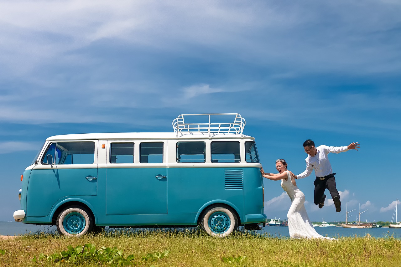 Bride and groom with campervan