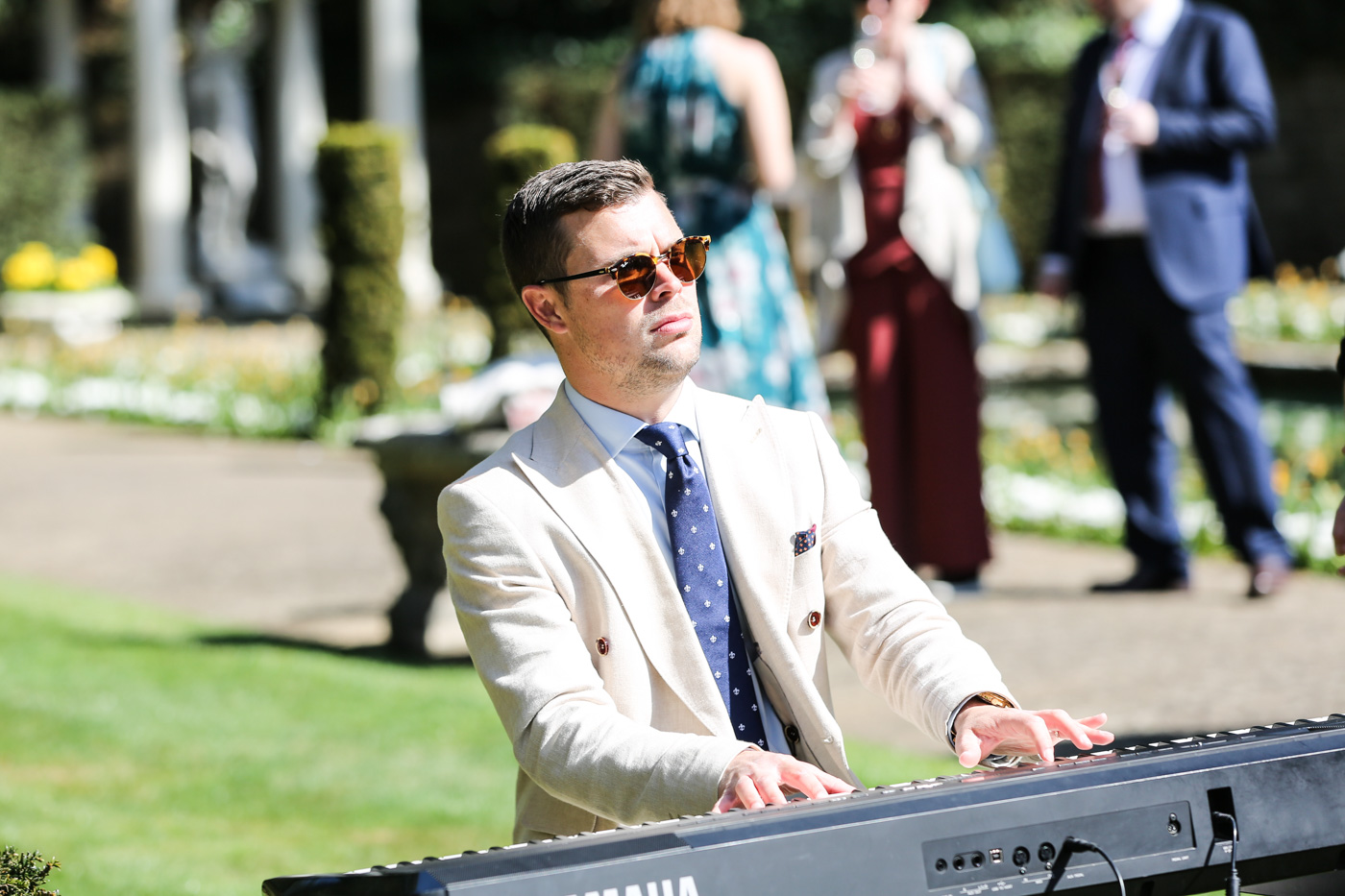 Dorset wedding pianist performing live during an outdoor wedding ceremony