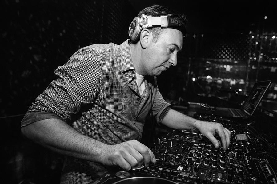 Ultimate Disco wedding DJ performing on modern mixing decks at a Dorset wedding reception