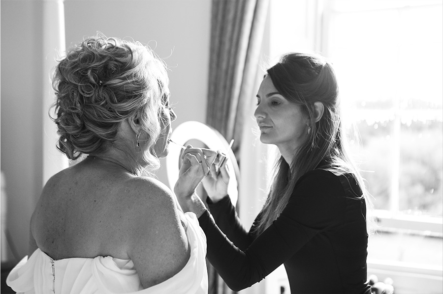 Wedding makeup artist Dorset applying bridal makeup Dorset during morning preparations