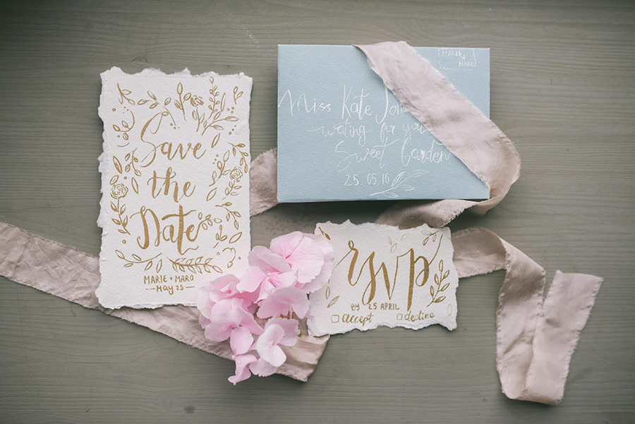 Dorset save the date wedding stationery with gold calligraphy and handmade paper styling