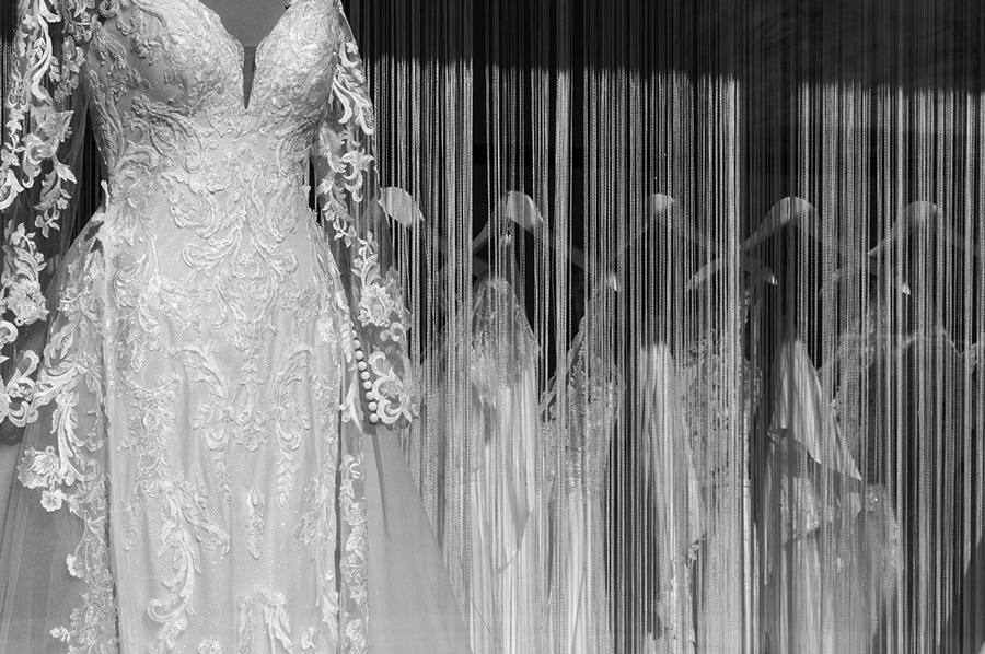 Wedding dresses displayed on a rail inside a Hampshire bridal boutique