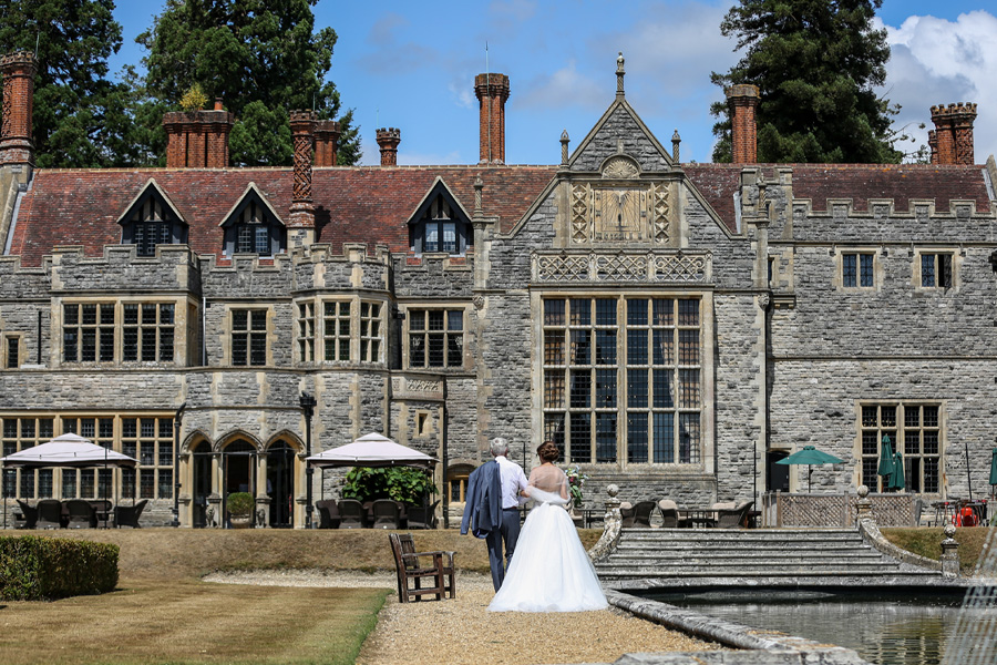 hampshire-country-house-wedding-venue-historic-estate-gardens Bride and groom at a historic country house wedding venue in Hampshire with formal gardens