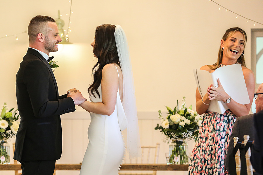 Wedding celebrant leading ring exchange ceremony at Hampshire wedding
