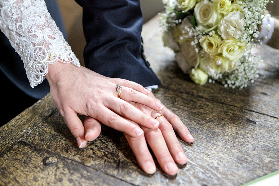 Couple signing wedding ceremony document during Hampshire celebrant wedding