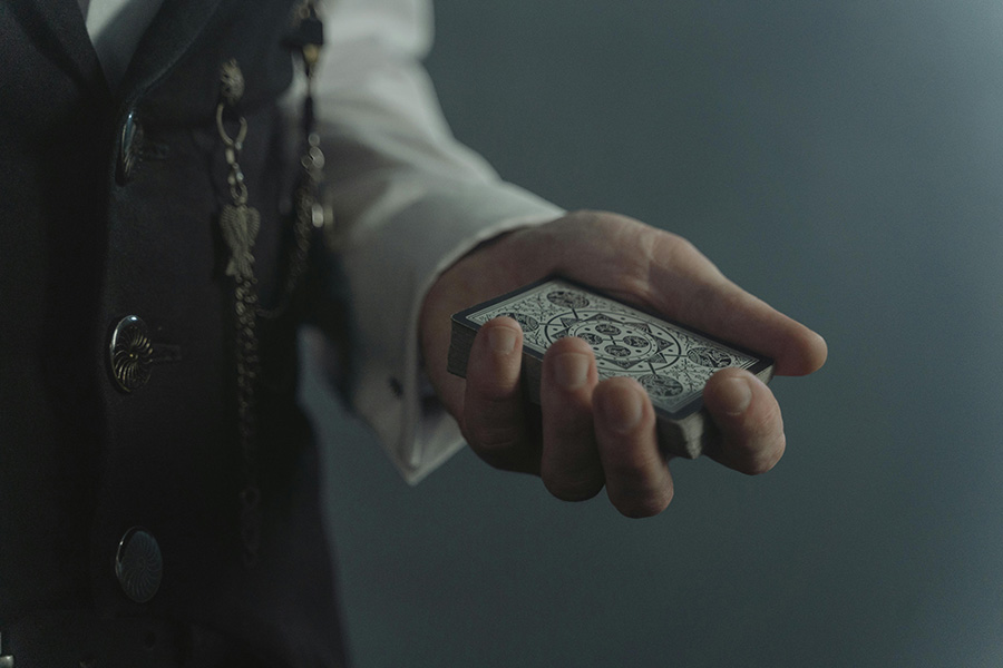 Wedding magician performing close up card magic during Hampshire wedding reception