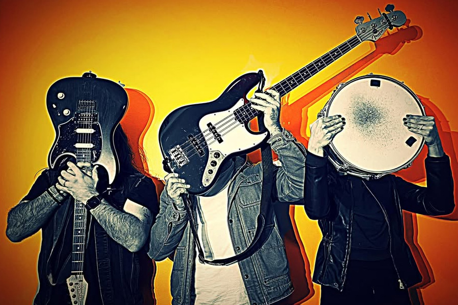 Live wedding musicians Hampshire featuring guitars and drums in promotional band image