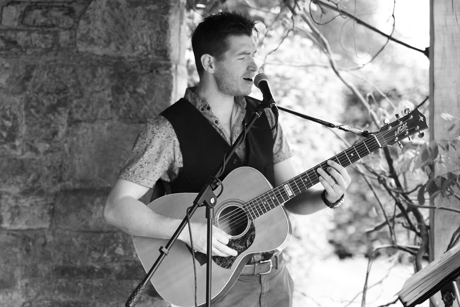 Harry North wedding singer Dorset performing live acoustic guitar at wedding ceremony