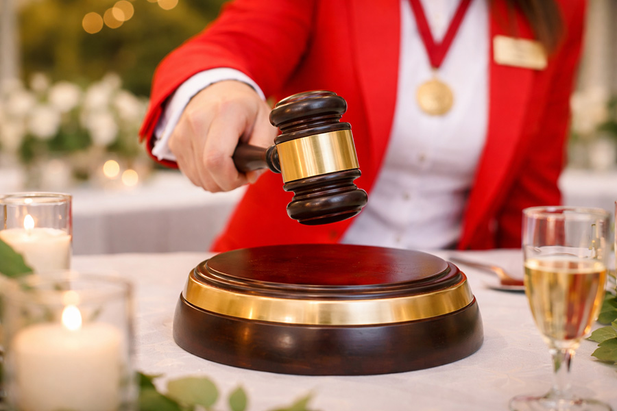 Close up of wedding toastmaster ceremonial hammer used for announcements and guest coordination