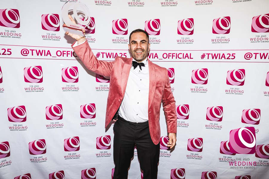 Bournemouth wedding magician Magic by Alfie holding award at wedding industry awards event