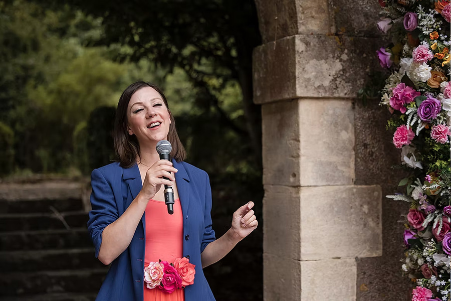 Charlie Greenwood wedding singer performing outdoors with microphone at a ceremony