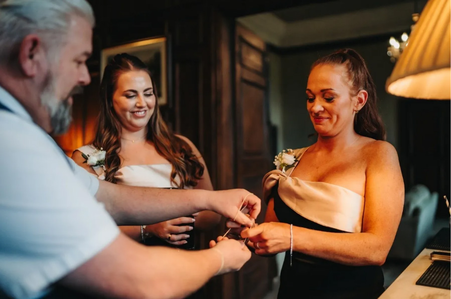 Chris Howat Magic performing close up magic for wedding guests during indoor Dorset wedding