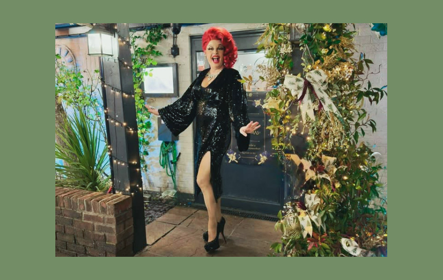 Drag wedding entertainer performing at a Dorset wedding venue with vibrant styling and live entertainment atmosphere