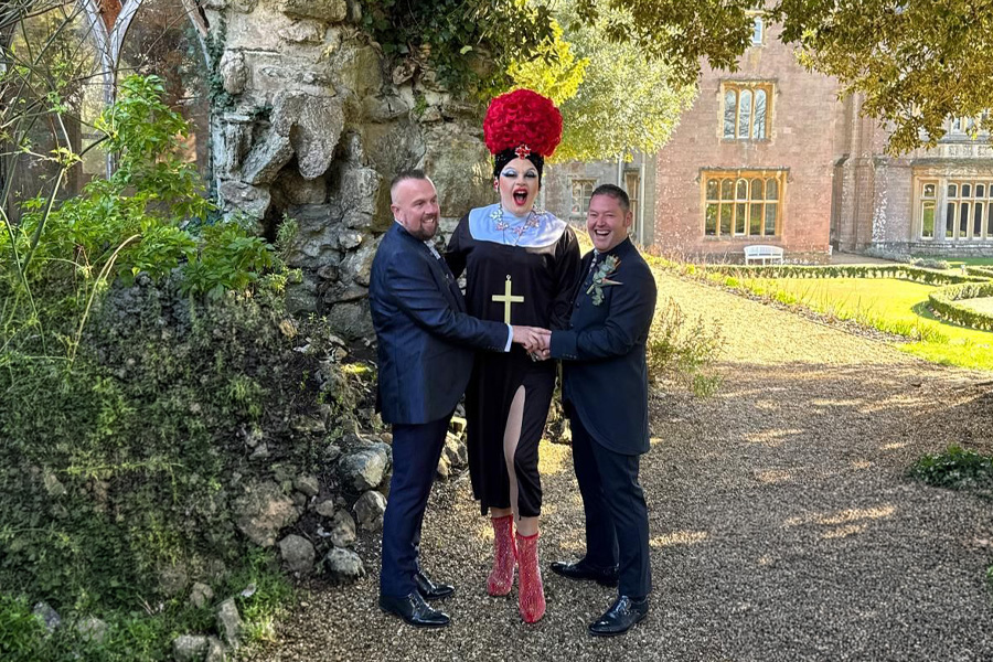 Drag queen wedding celebrant UK performing inclusive outdoor wedding ceremony with couple