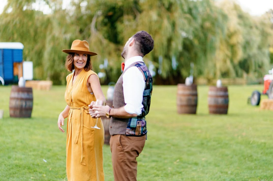 Couple walking outdoors at a Hampshire wedding with planner coordination creating a relaxed and natural atmosphere