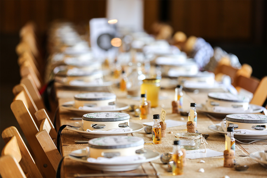 Elegant wedding table styling by Hampshire wedding planners with candles, glassware and coordinated place settings
