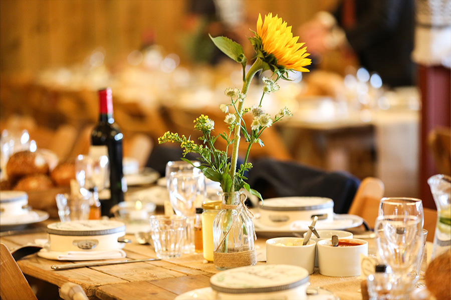 rustic wedding table styling with sunflower centrepiece and decor