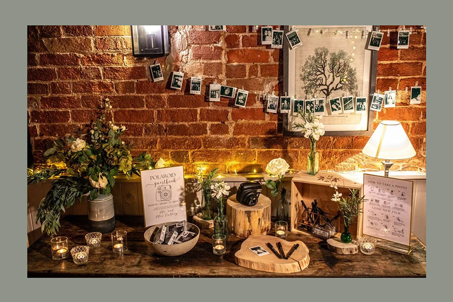 Mae and Maple wedding prop styling display with rustic decor candles and photo setup Hampshire