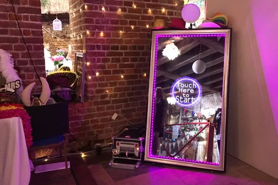 Magic mirror photo booth setup at a Dorset wedding venue with interactive touch screen and LED lighting