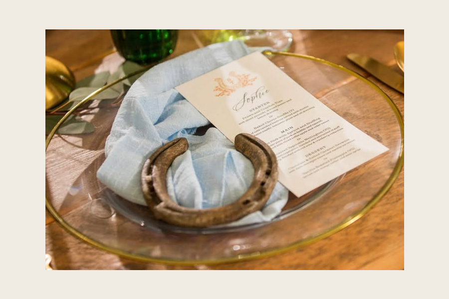 Poole wedding stationery place setting with menu card and horseshoe detail at Dorset wedding