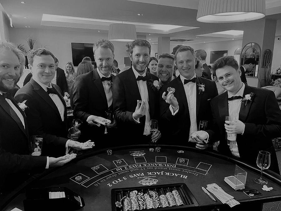 Guests enjoying interactive casino entertainment with Lost Vegas<br />
 at a Hampshire wedding reception