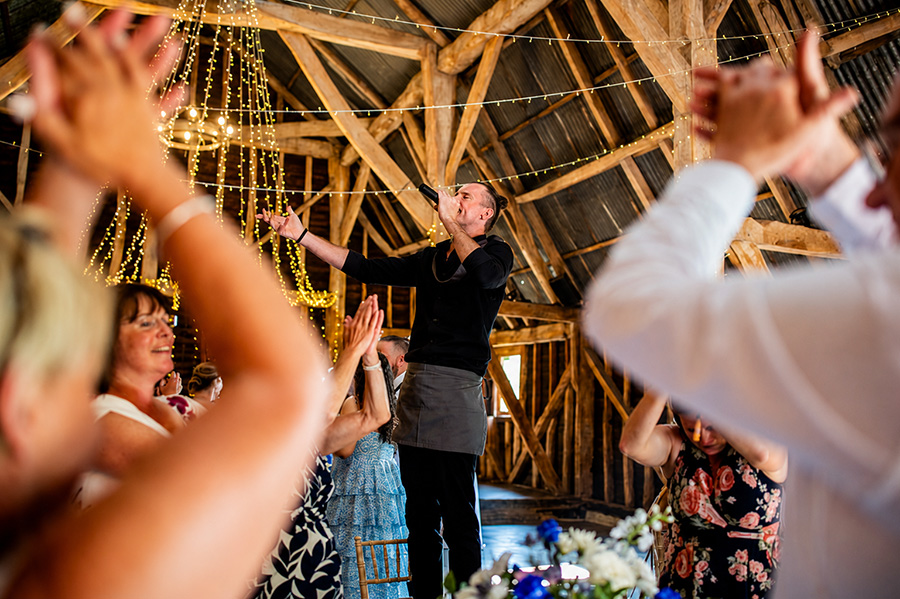 VIP Waiters performing live singing waiter entertainment at a Hampshire barn wedding