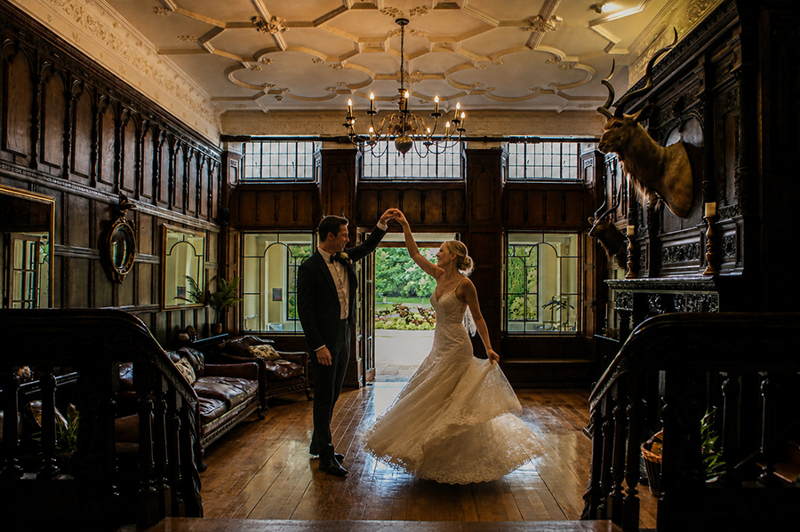Bride and groom dancing inside Efford Park Manor during a luxury wedding weekend in Hampshire.