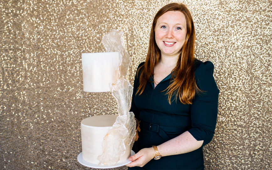CK Bakes wedding cake designer holding a bespoke wedding cake in Amesbury, Wiltshire